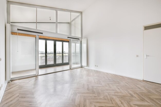 Room with large windows and parquet floor