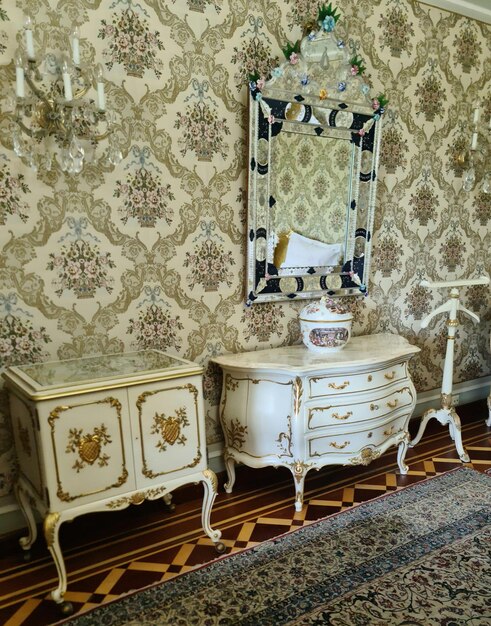 A room with a mirror and dresser