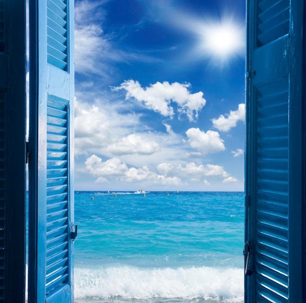 Room with open door to seascape