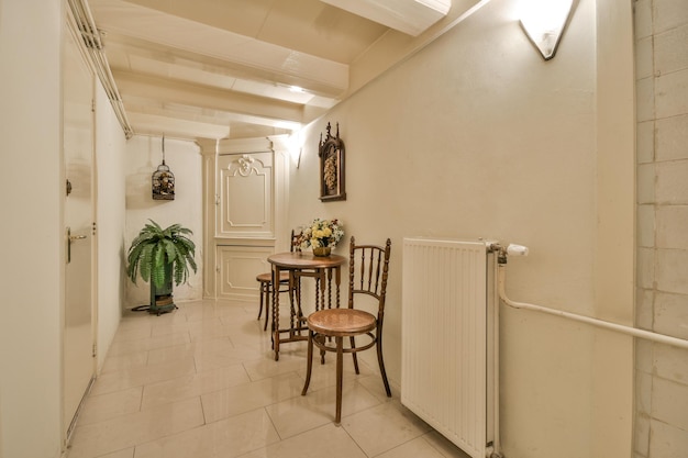 A room with a table and chairs in the hallway