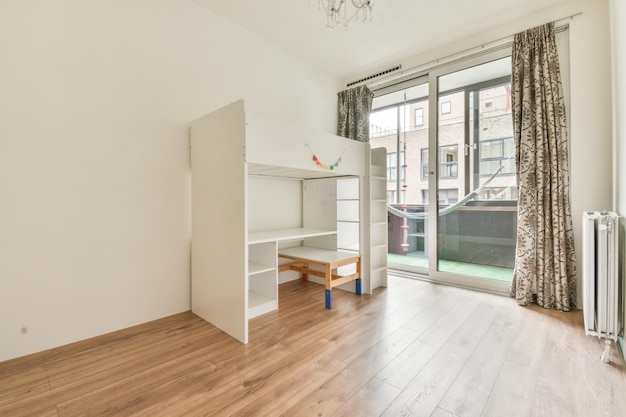 Room with white baby cot