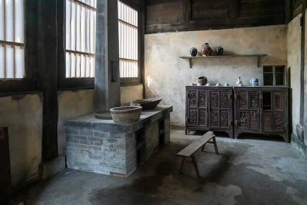 A room with a wooden table and a wooden bench in it