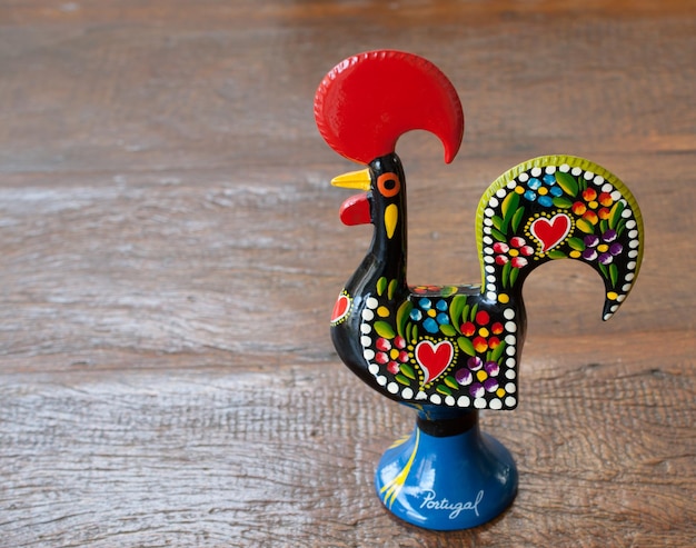 Rooster of Barcelos on a wooden table