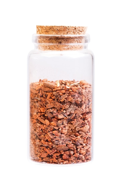 Root of Rubia Tinctorum in a bottle with cork stopper for medical use.