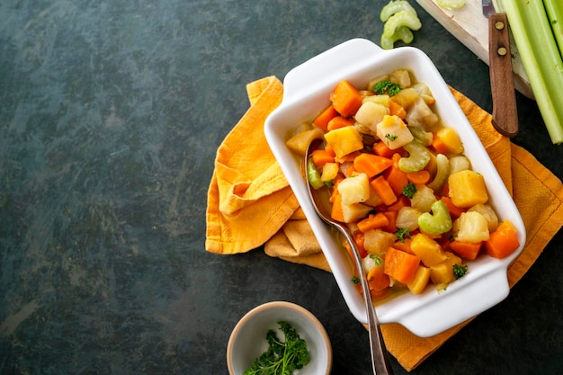 Root vegetable casserole with sweet potato celery parsnip carrot Comfort food Top view