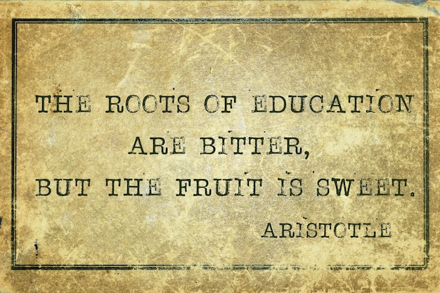 The roots of education are bitter- ancient Greek philosopher Aristotle quote printed on grunge vintage cardboard