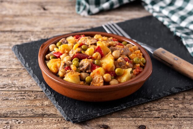 Ropa vieja dish on a wooden table