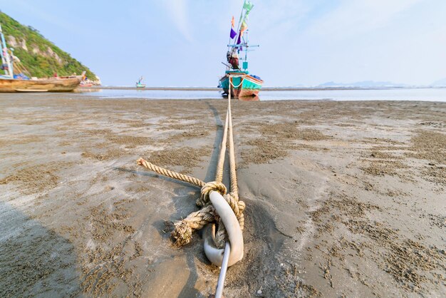 Rope on beach against sky