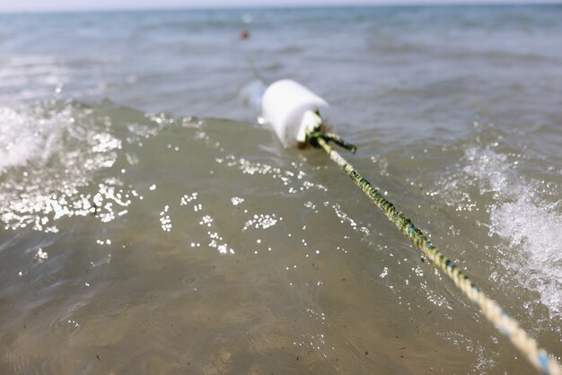 Rope fence in ocean for swimming area.