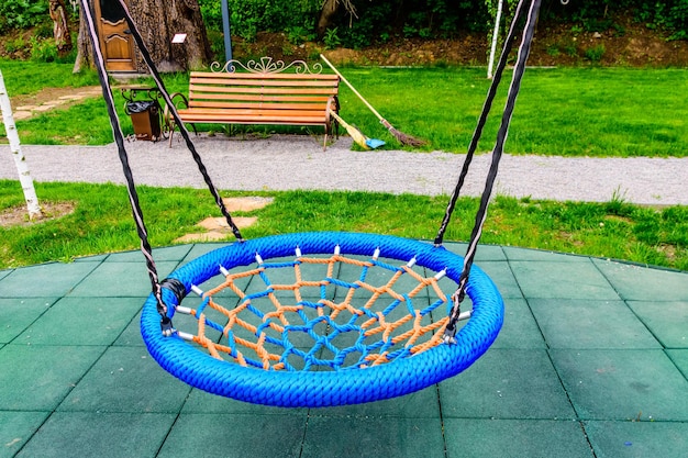 Rope swing on children playground in a city park