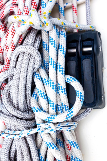 Ropes with fasteners for sails on a yacht closeup