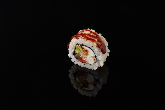 Roru with salmon sushi on a black background