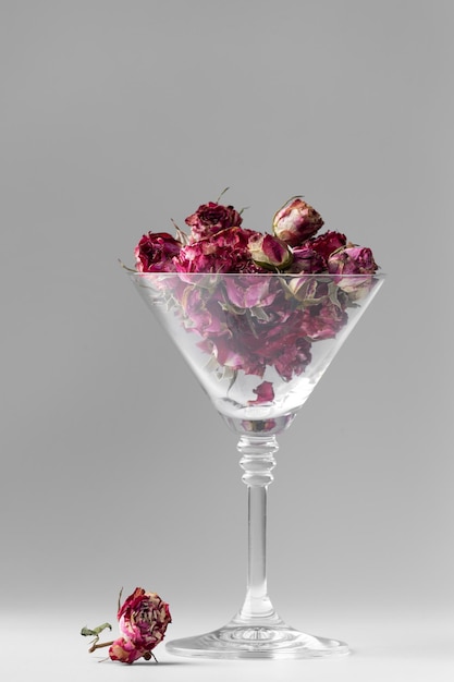 Rose buds in a glass goblet isolated