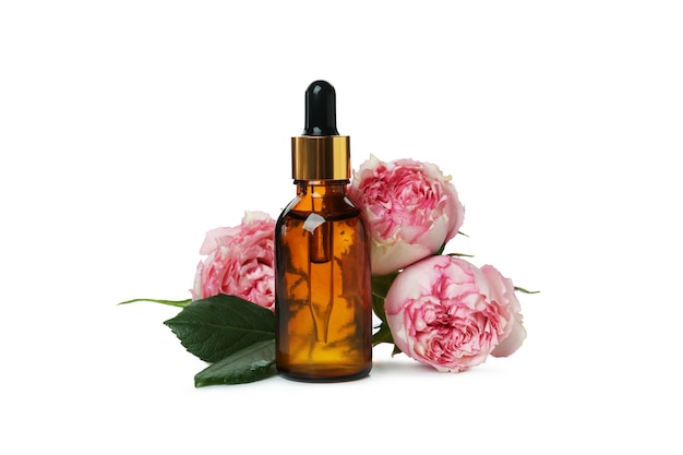 Rose essential oil isolated on white