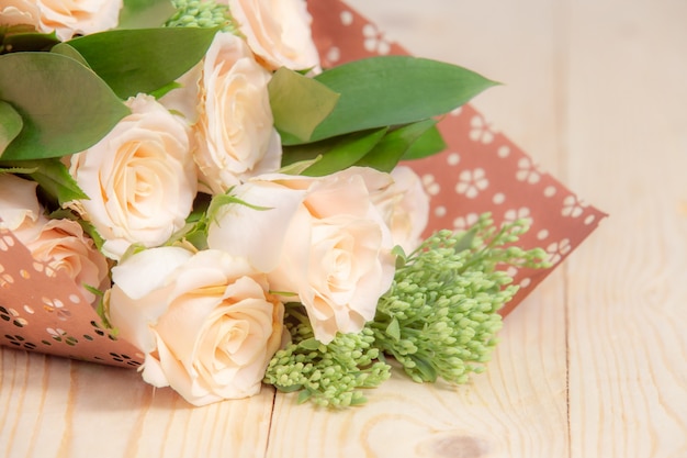 Rose flower on wooden table