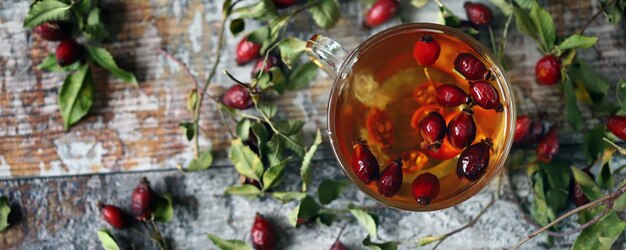 Rose hip Tea with rosehip in a glass cup