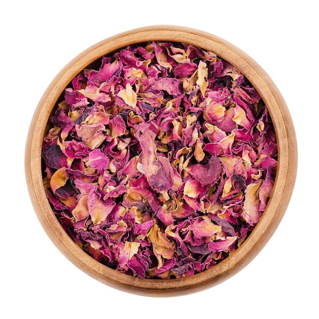 Rose petals in a bowl on white background