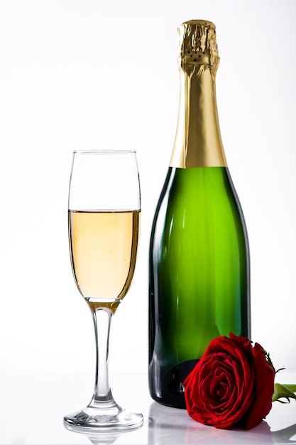 Rose with champagne bottle and cup