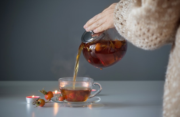 Rosehip tea on white table in kitchen