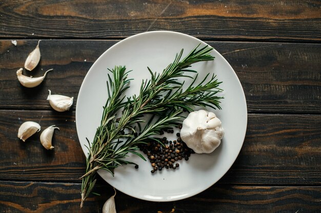 Rosemary, garlic and pepper on a plate