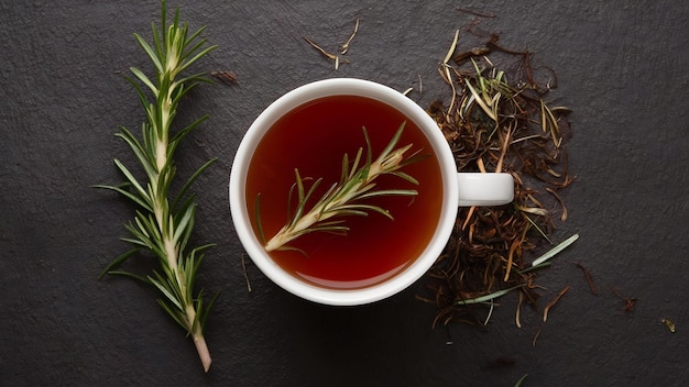 Rosemary hot tea in cup ready to drink