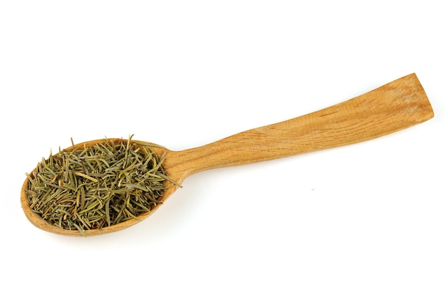 Rosemary seasoning in a wooden spoon isolate