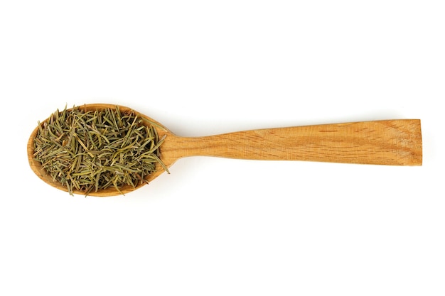 Rosemary seasoning in a wooden spoon isolate