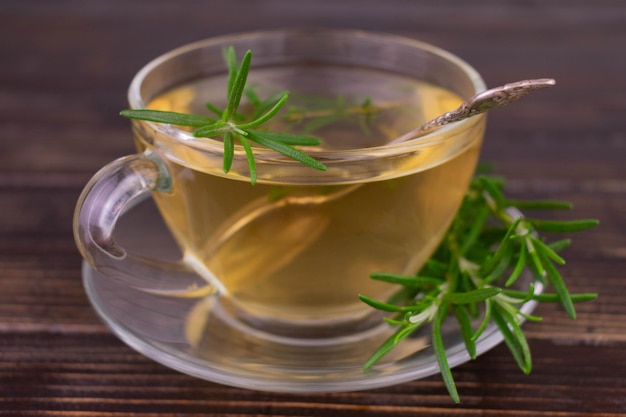 Rosemary tea in a glass transparent cup.Close-up.