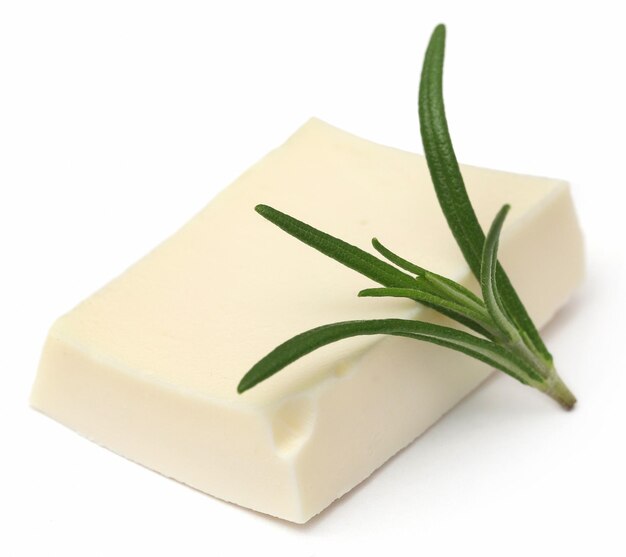 Rosemary with cheese over white background