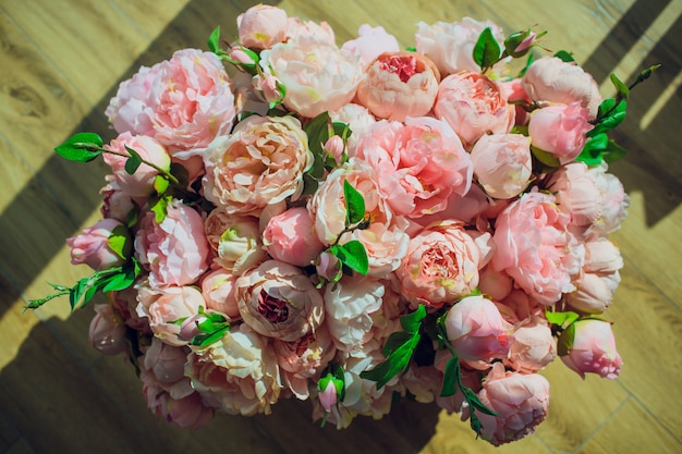 Roses in a box on wooden background