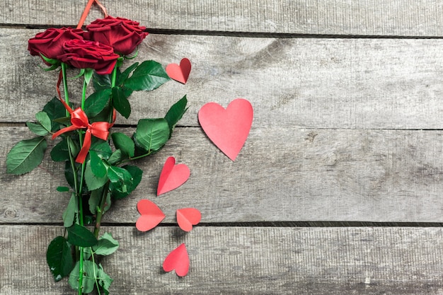 Roses and a hearts on wooden board, Valentines Day background