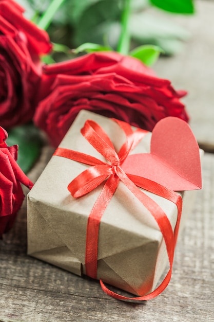 Roses and a hearts on wooden board, Valentines Day 