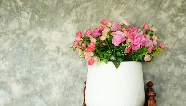 Roses in pots cement wall background