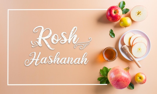 Rosh hashanah Jewish New Year holiday Concept of traditional or religion symbols on pastel orange paper background