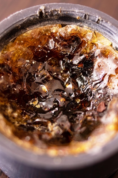 Rosin in a jar on a wooden table