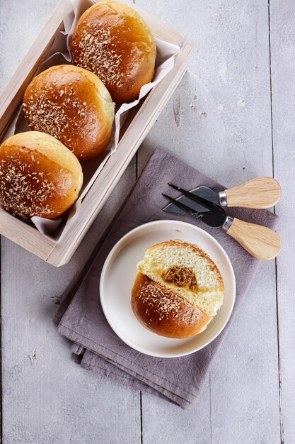 Photo roti isi unti kelapa or coconut buns with shredded coconut javanese sugar filling