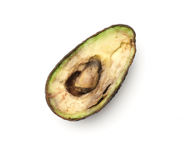 Rotten overripe halved avocado isolated on white