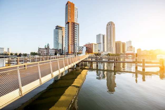 ROTTERDAM, NETHERLANDS - August 06, 2017: Cityscape view on the modern district with beautiful skyscrapers at the Rijn port during the morning in Rotterdam