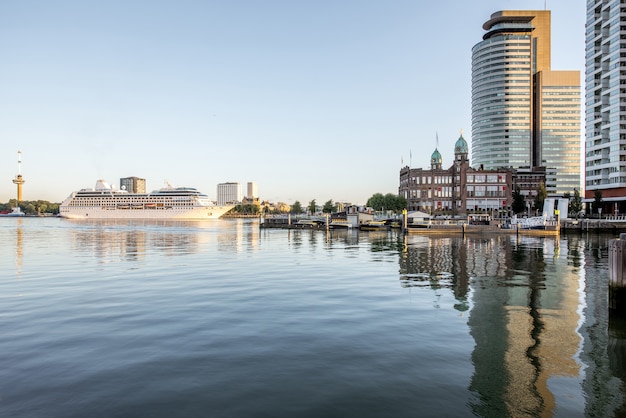 ROTTERDAM, NETHERLANDS - August 06, 2017: Cityscape view on the modern district with beautiful skyscrapers at the Rijn port during the morning in Rotterdam