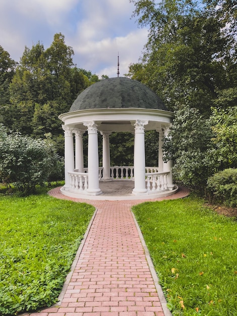 Rotunda in the park Antique gazebo in the autumn Park