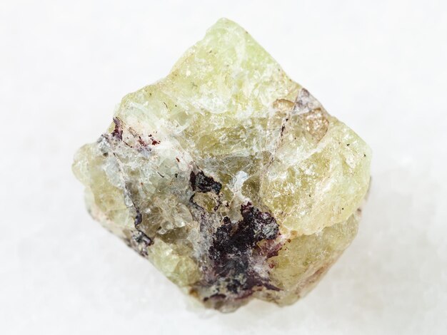 Rough crystal of Saamite fluorapatite on white