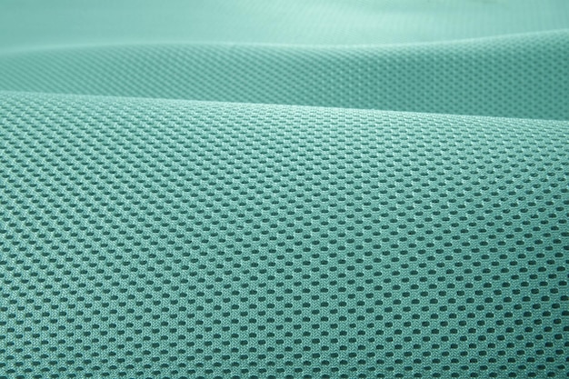Foto rough pool groene stof textuur katoen gebreide stof moderne waterdichte flexibele temperatuur controle materialen multifunctionele slimme textiel close-up selectieve focus scheurt niet