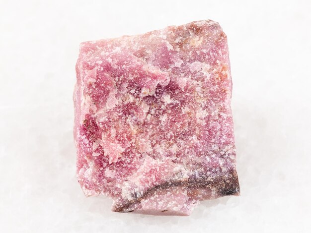 Rough rhodonite stone on white