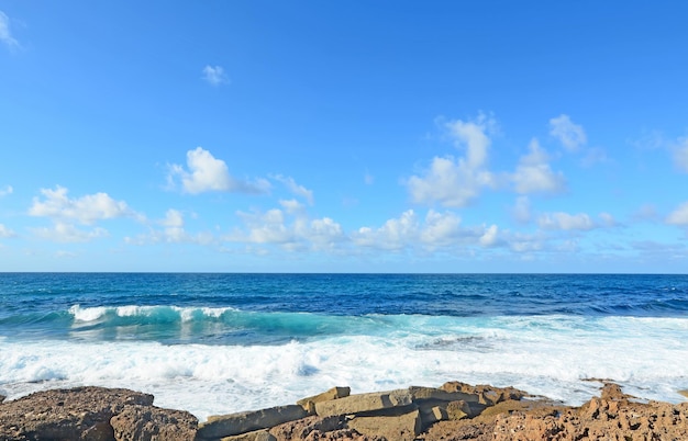 Rough sea under a blue sky in Argentiera Sardinia