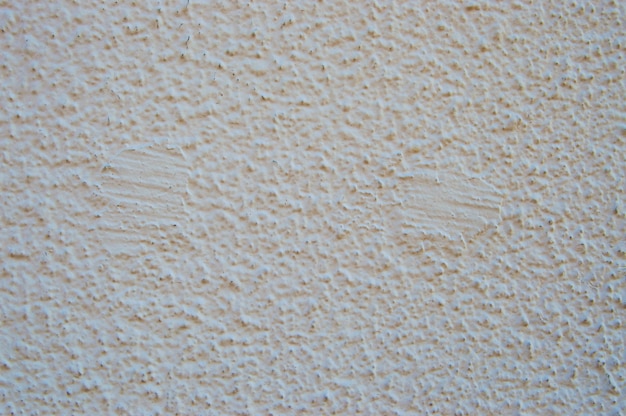 Photo rough surface covered with white paint texture and background