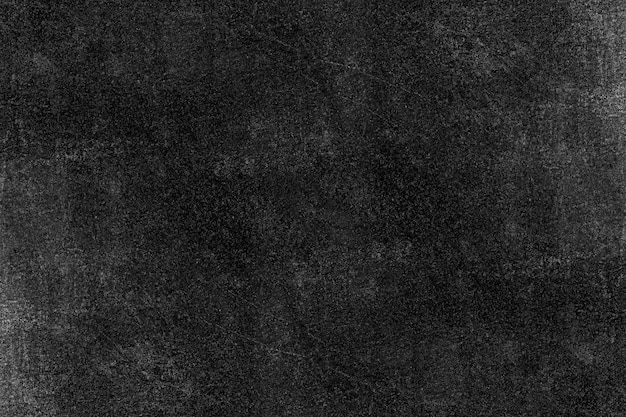 Rough textured dark surface of aged cement plaster wall for background