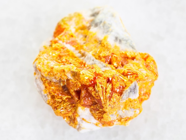 Rough yellow Orpiment crystals on white dolomite