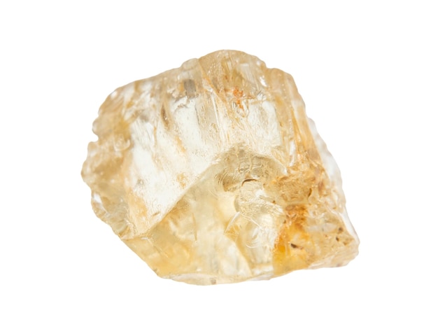 rough yellow scapolite crystal isolated on white