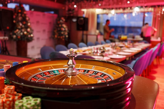 Roulette, chips and ball for the casino in the interior of the club.