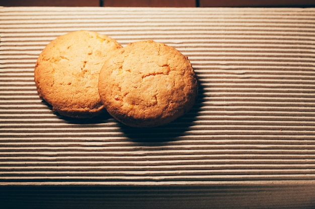 Round biscuits on textured table